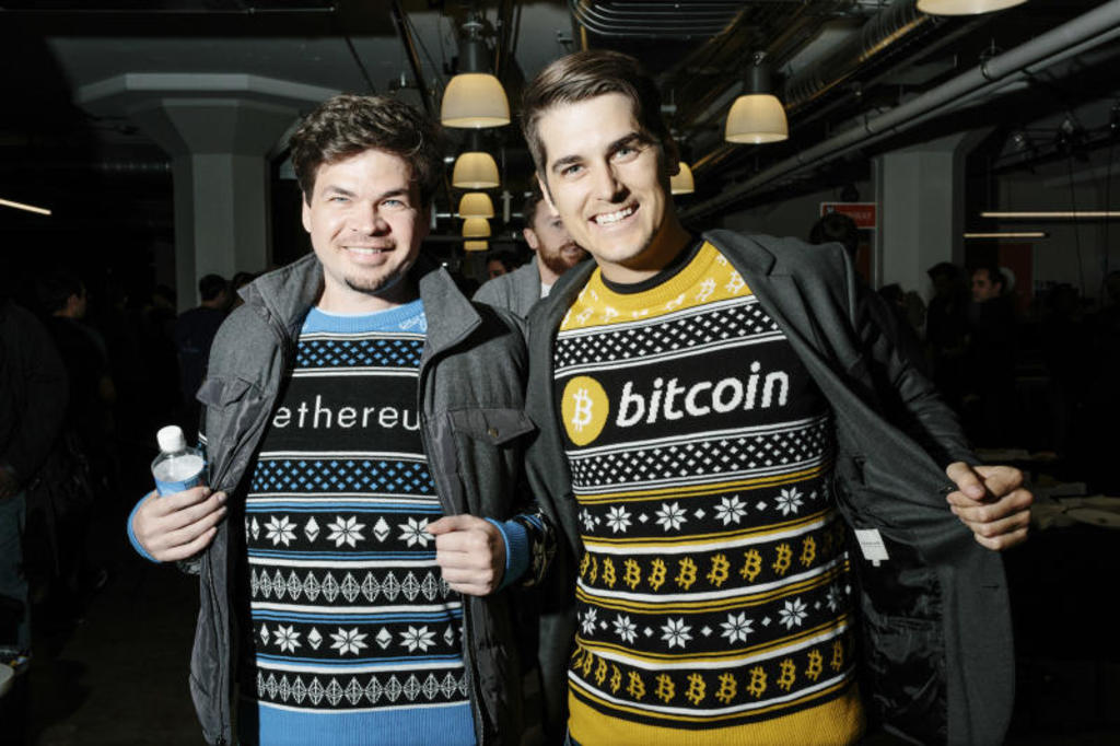Participants show off their enthusiasm for cryptocurrencies at the annual San Francisco Bitcoin Meetup Party on Dec 14, 2017.